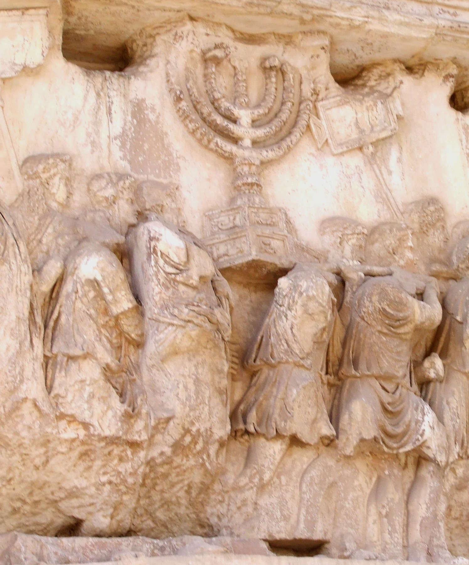 The spoils of Jerusalem on the Arch of Titus, with the Temple's lampstand carried in the procession.